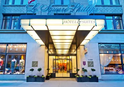 a store front of a hotel and suites at Le Square Phillips Hôtel & Suites in Montréal