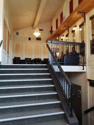 a staircase in a building with a stair case at Hotellerie Jardins de Ville in Sherbrooke