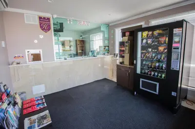a store with a soda machine in front of a counter at Auberge St. Jacques in Montréal