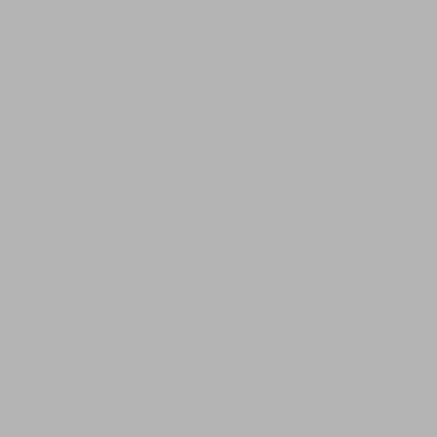 a kitchen with wooden cabinets and a brick wall at Lofts du Vieux-Port by Gray Collection in Montréal