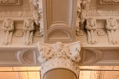 a building with statues on the side of it at Hôtel Birks Montréal in Montréal