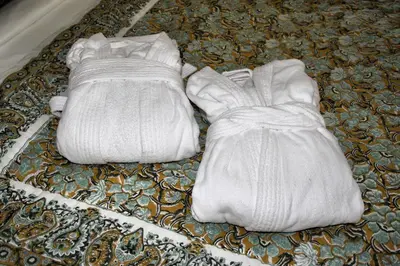 two white shoes sitting on top of a rug at Domaine Jolivent in Lac-Brome