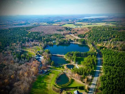 an aerial view of a lake in the countryside at Domaine Gagnon in Saint Sebastien