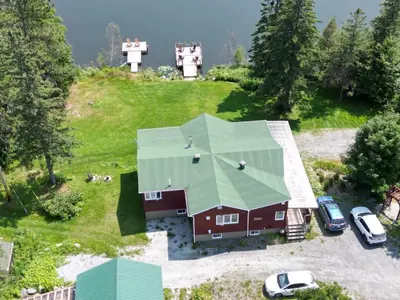 an aerial view of a house with a green roof at Domaine Gagnon in Saint Sebastien