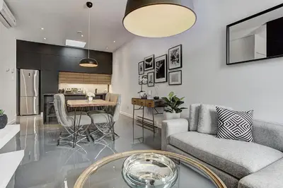 a living room with a couch and a table at Les Lofts du Centre by Simplissimmo in Montréal
