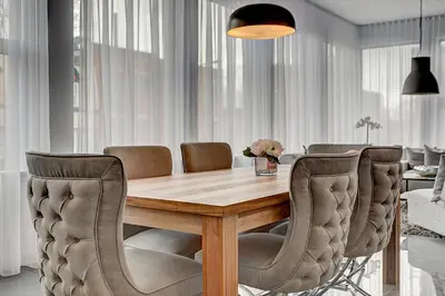 a dining room with a wooden table and chairs at Les Lofts du Centre by Simplissimmo in Montréal