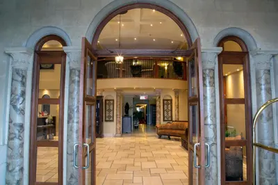 an entrance to a building with an archway at Hotel Brossard in Brossard