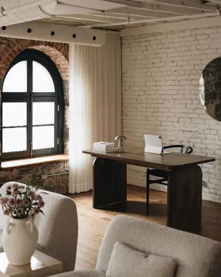 an office with a desk with a laptop on it at Saint Sulpice Lofts by Bakan - Old Montreal in Montréal