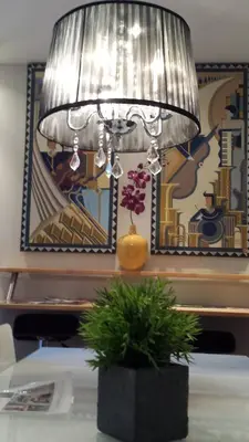 a lamp sitting on top of a table with a plant at Lofts Jacques-Cartier Free Parking in Montréal