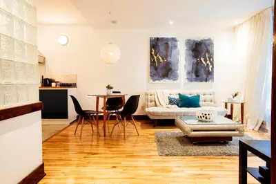a living room with a couch and a table at Lofts Jacques-Cartier Free Parking in Montréal