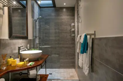 a bathroom with a sink and a shower at Lofts Jacques-Cartier Free Parking in Montréal
