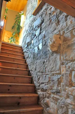 a stone wall and stairs in a house at Manoir Ramezay in Marieville