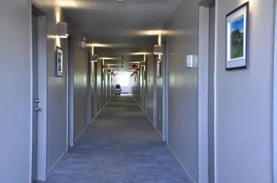 a corridor of a hallway with a hallway at Hotel Transit in Mont-Saint-Hilaire