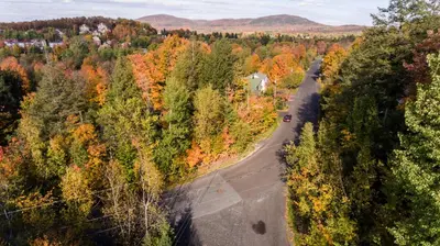 an aerial view of a road in a forest at Le Gite A Margot in Bromont
