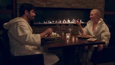 a man and woman sitting at a table eating food at Kinipi Spa Nordique & Hebergement in Trois-Rivières