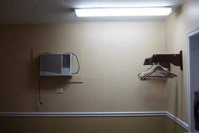 a room with a wall with a air conditioner on the wall at Motel Montreal in Notre-Dame-de-l'Île-Perrot