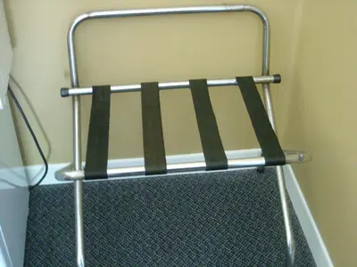 a towel rack in the corner of a room at Motel Montreal in Notre-Dame-de-l'Île-Perrot