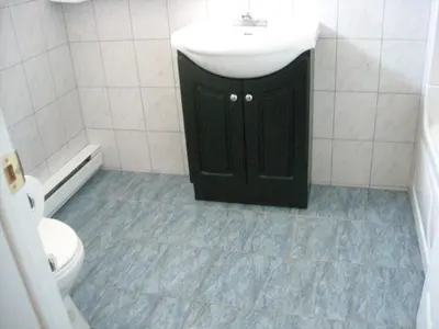 a bathroom with a sink and a toilet at Motel Montreal in Notre-Dame-de-l'Île-Perrot