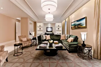 a living room with a couch and a table at The Ritz-Carlton, Montreal in Montréal