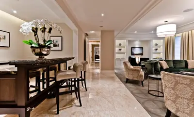 a living room and dining room with a table and chairs at The Ritz-Carlton, Montreal in Montréal
