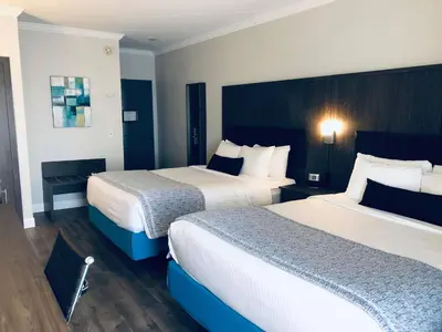 a hotel room with two beds in a room at Best Western Laval-Montreal & Conference Centre in Laval