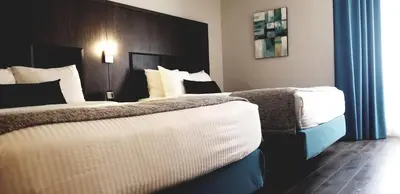 a hotel room with two beds in a room at Best Western Laval-Montreal & Conference Centre in Laval