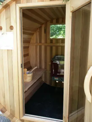 a inside view of a wooden sauna with a window at Ô Bois Dormant B&B in Magog-Orford