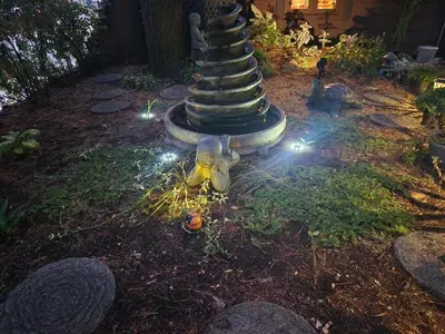 a stuffed animal is sitting in front of a pole with lights at Guesthouse Refuge du Poète Montreal-Longueuil in Longueuil