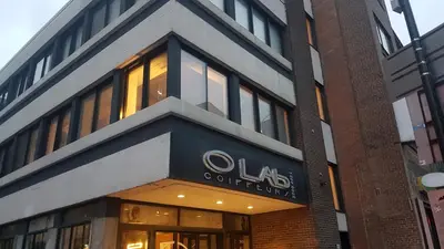 a building with a sign on the side of it at mtlFlats - Condotel Le Luxe in Montréal