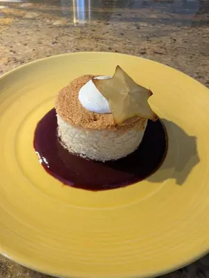 a piece of cake on a yellow plate at Au Saut Du Lit in Magog-Orford