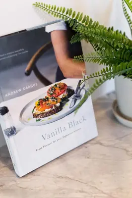 a box with a plate of food on a table at Little Italy Spacious 2 Bedroom Condo Free Parking in Montréal