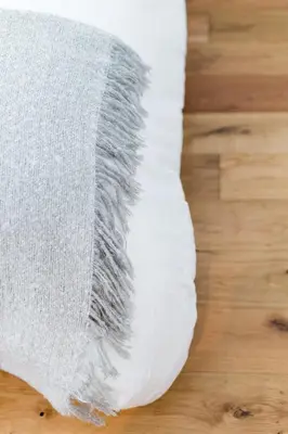 a white towel on a wooden floor at Little Italy Spacious 2 Bedroom Condo Free Parking in Montréal
