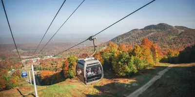 a group of people riding on a ski lift at O'Berge du Village C304 - Bord de l'eau in Magog-Orford