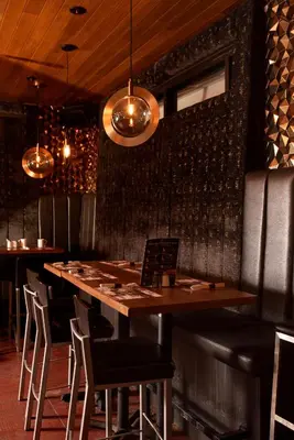 a dining room with a wooden table and chairs at Hotel-Resto-Bar Le Journel in Saint-Joseph-de-Beauce