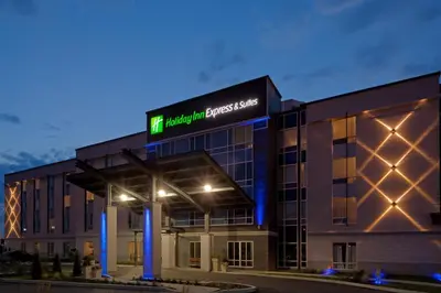 a building with a sign on top of it at Holiday Inn Express Hotel & Suites Saint - Hyacinthe by IHG in Saint-Hyacinthe