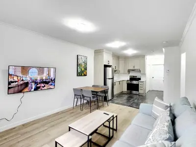 a living room with a couch and a table at APARTMENT HOTEL ST-DENIS in Montréal