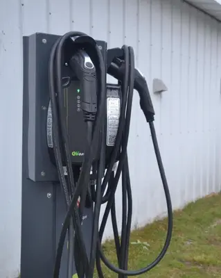 a pay phone is hooked up to a gas pump at Auberge Papillon Lune in Richmond