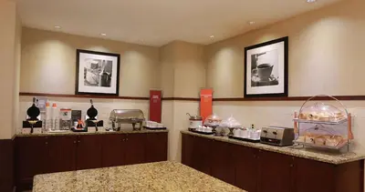 a kitchen with aasteryasteryasteryasteryasteryasteryasteryasteryasteryasteryasteryastery at Hampton Inn & Suites Laval in Laval