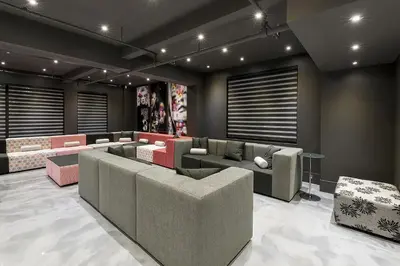 a living room with couches and chairs in a room at The Holland Hotel by Simplissimmo in Montréal