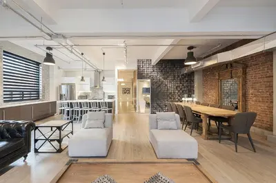 a dining room with a table and chairs at The Holland Hotel by Simplissimmo in Montréal