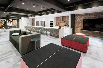 a living room with a couch and a bar at The Holland Hotel by Simplissimmo in Montréal