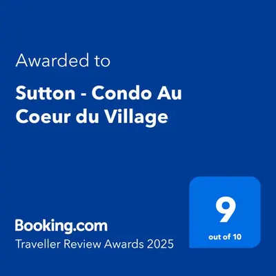 a blue sign with the wordsuador corona au corona au course dvd at Sutton - Condo Au Coeur du Village in Sutton