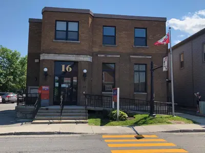 a brick building with the number on it at Sutton - Condo Au Coeur du Village in Sutton