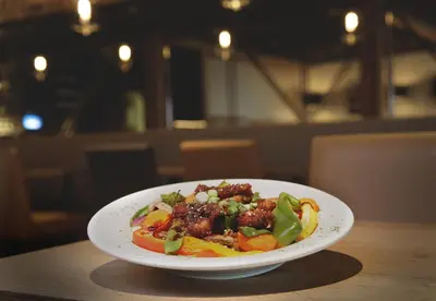 a white plate of food on a table at Complexe Hotelier Le 55 in Bécancour