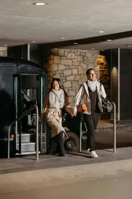 a man and a woman sitting on a bus at Sheraton Montreal Airport Hotel in Dorval