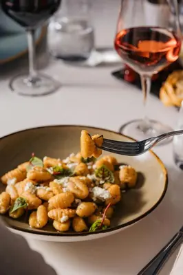 a plate of food on a table with a fork at Sheraton Montreal Airport Hotel in Dorval