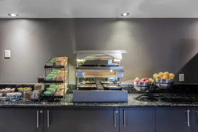 a kitchen with some food on a counter at Hotel Faubourg Montreal Centre-Ville Downtown in Montréal