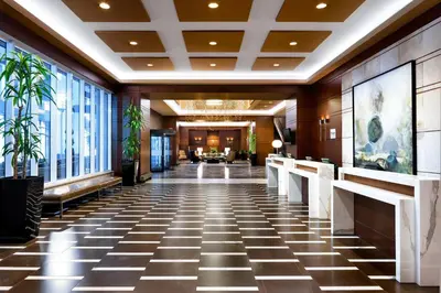 a lobby of a hotel with a checkered floor at Le Westin Montreal in Montréal