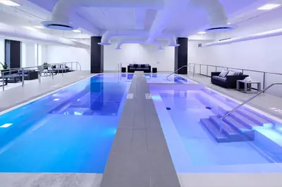 a large swimming pool in a building at Le Westin Montreal in Montréal