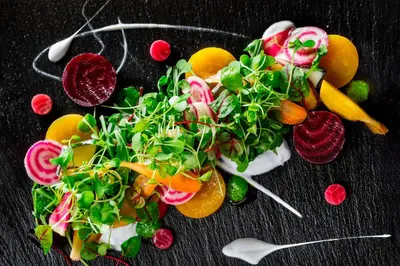 a bunch of fruits and vegetables on a table at Le Westin Montreal in Montréal